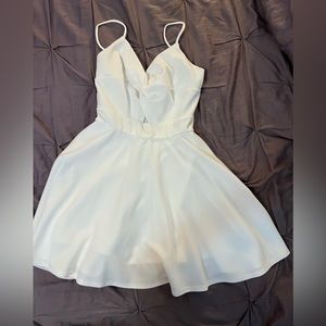 White spaghetti dress with shorts underneath. Worn once, size small.